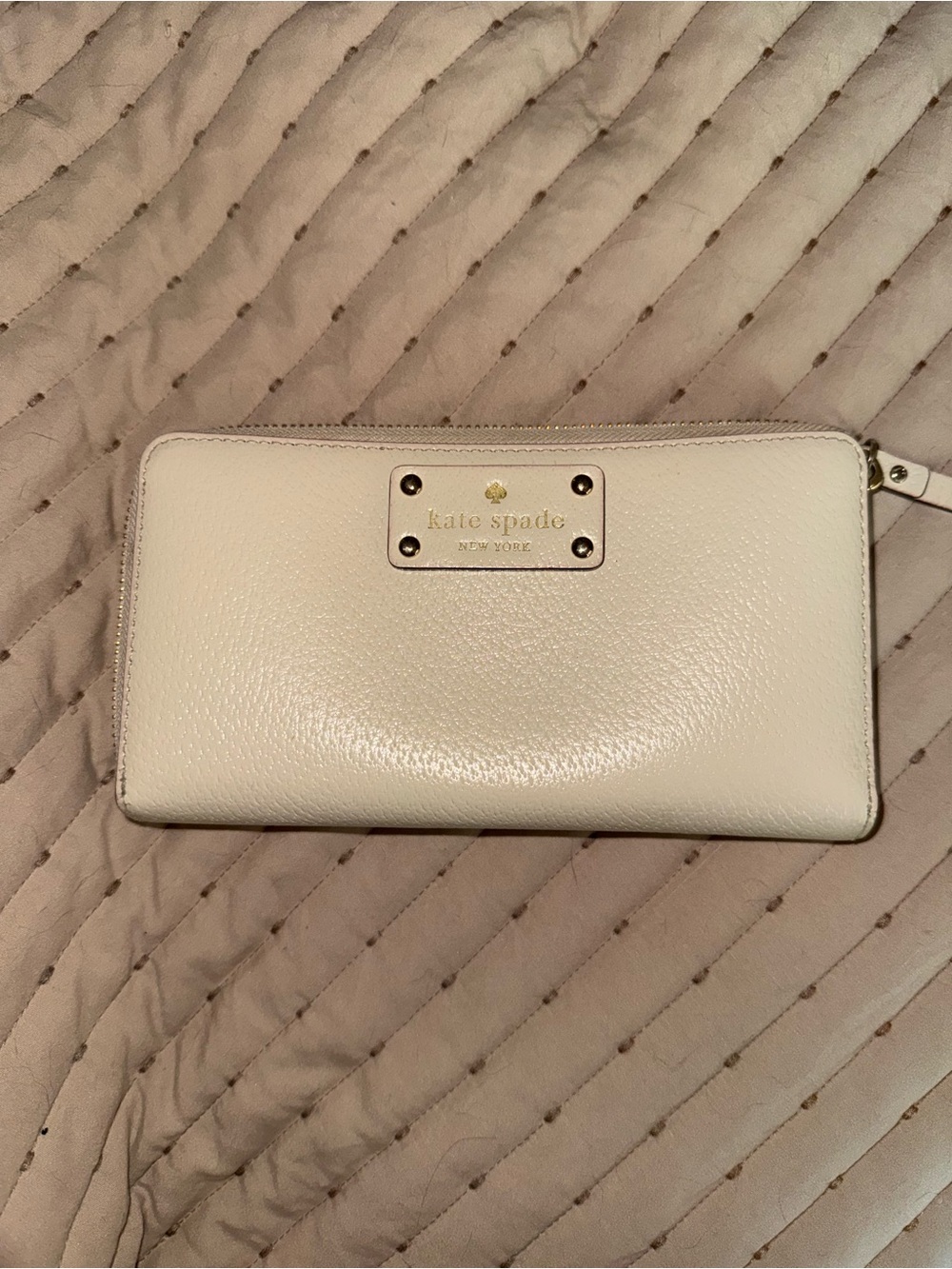 kate spade Cream Pebbled Leather Zip-Around Wallet with Logo Plaque